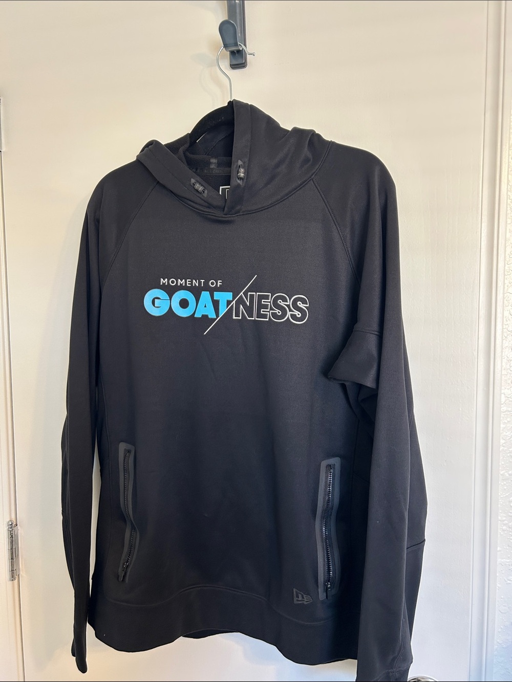 New Era Black Hoodie with Blue GOATNESS Logo